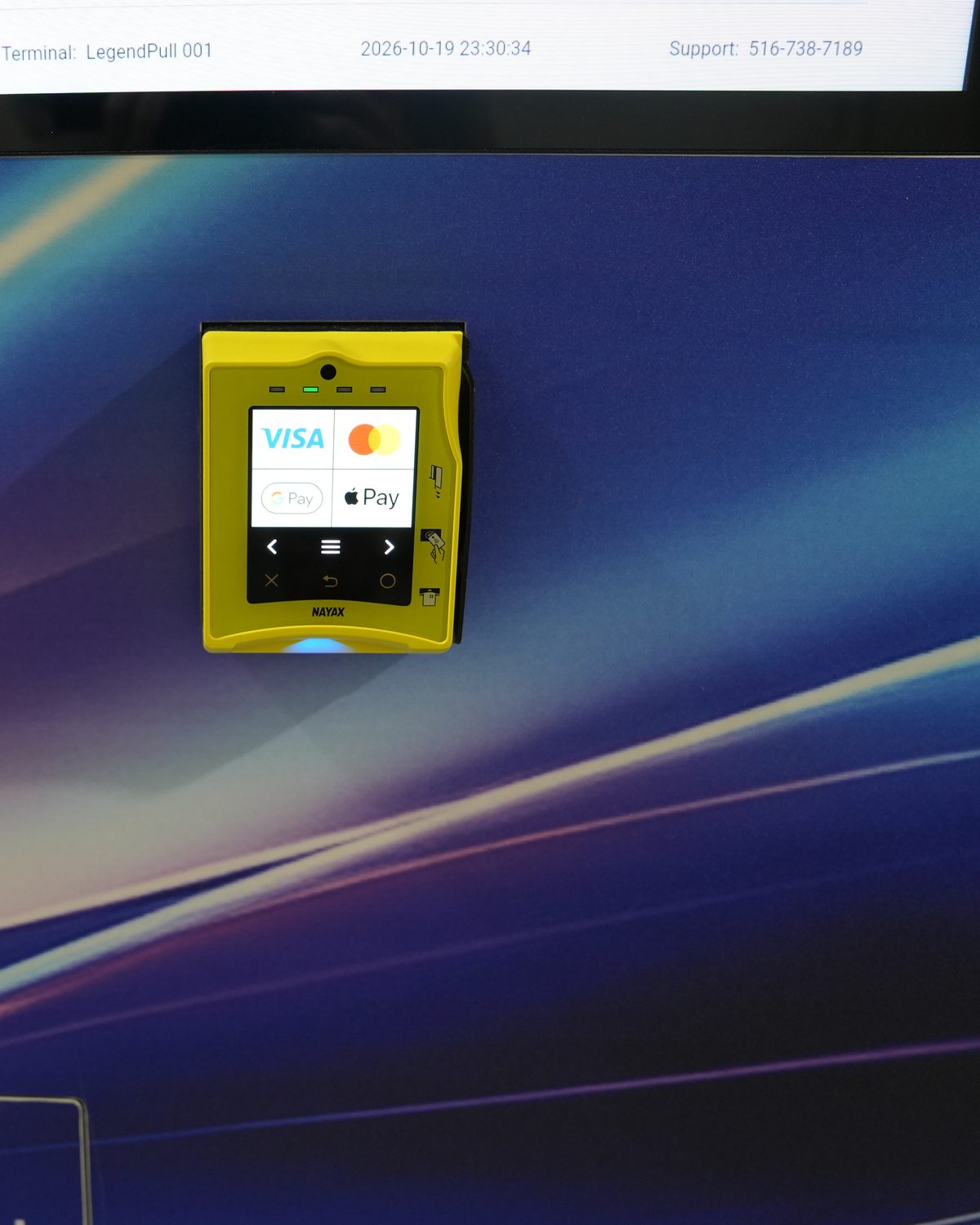 Close-up of the yellow tap-to-pay card reader